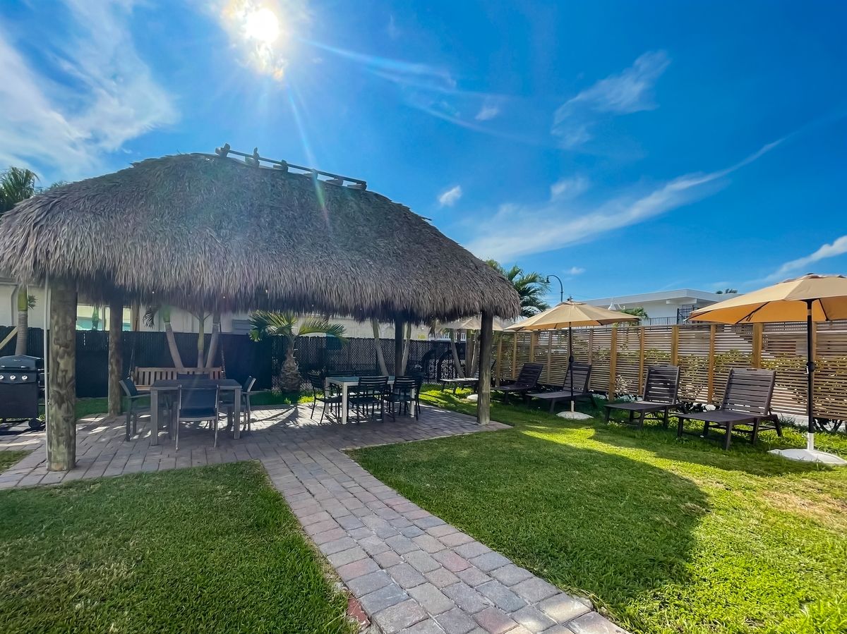 The tiki hut and lawn